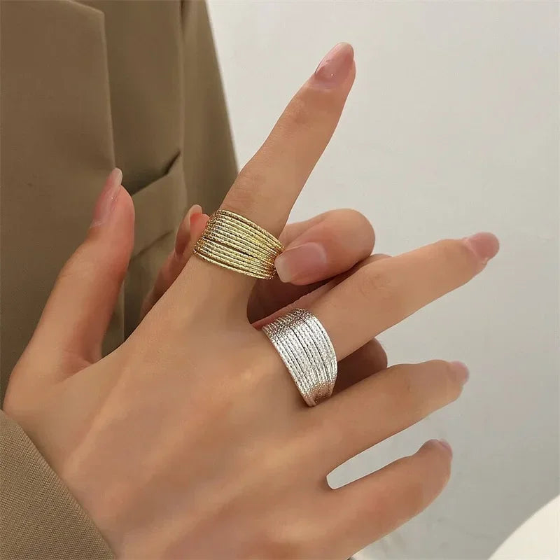 Elevate your everyday look with this modern minimalist ring featuring elegant multi-layer line detailing. Crafted in a sleek silver finish, this versatile piece adds a touch of sophistication to any outfit.