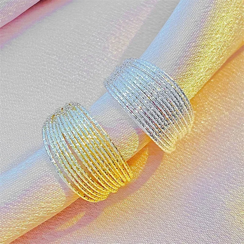 Elevate your everyday look with this modern minimalist ring featuring elegant multi-layer line detailing. Crafted in a sleek silver finish, this versatile piece adds a touch of sophistication to any outfit.
