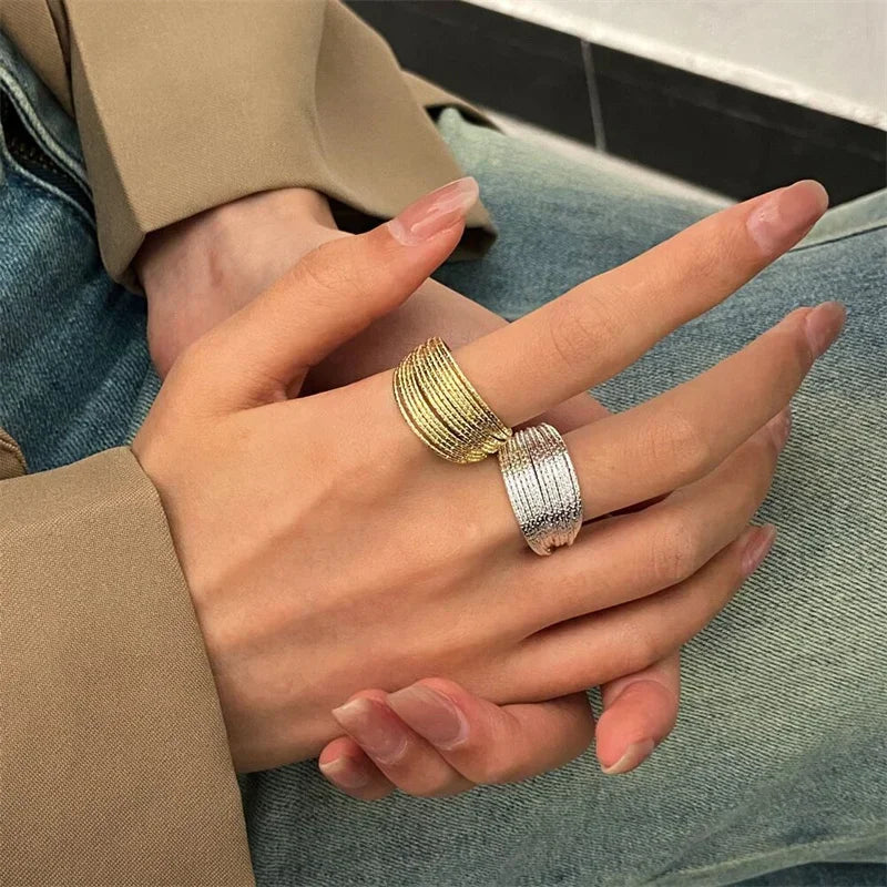 Elevate your everyday look with this modern minimalist ring featuring elegant multi-layer line detailing. Crafted in a sleek silver finish, this versatile piece adds a touch of sophistication to any outfit.