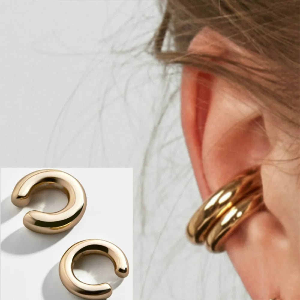 Add a touch of modern elegance with these minimalist gold ear cuffs. Designed in a sleek C-shape geometric style, they clip comfortably onto the ear—no piercing needed.